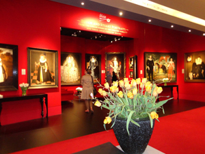 The TEFAF stand of London's Weiss gallery who sold the four important Tudor portraits on the back wall during the opening hour of the fair. The full-length portrait of Henry VIII on the right, known as The Ditchley Henry VIII, sold at an asking price of £2.5 million ($3.9m). Image Auction Central News.